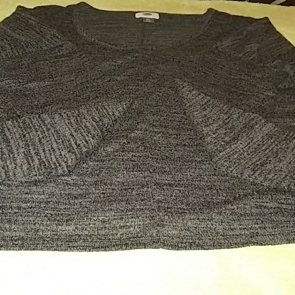 A grey and black thin sweater
